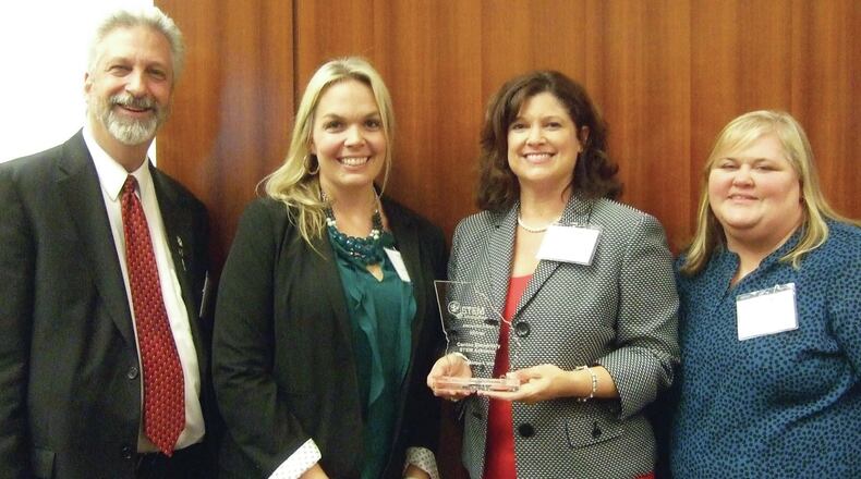 Celebrating the 2016 Georgia STEM Education Award for Elementary Schools are, from left to right, Peter Gleichman of Partner in Education, the Rotary Club of Canton; and Canton ES STEM Academy STEM Education Specialist Dr. Judy Wright, Principal Beth Long and STEM Program Coordinator Emma Griffin.