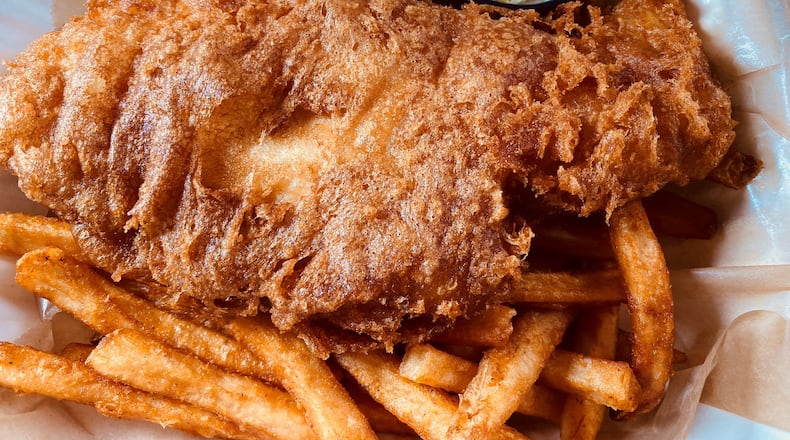 Wheelhouse's beer-battered fish and chips is served with slaw and tartar sauce. Bob Townsend for The Atlanta Journal-Constitution