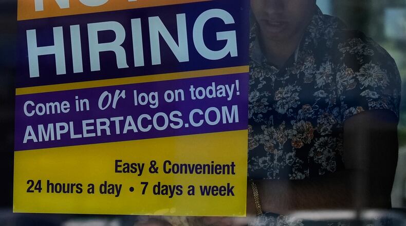 FILE - A hiring sign is displayed at a restaurant in Niles, Ill., Thursday, May 14, 2026. (AP Photo/Nam Y. Huh, File)