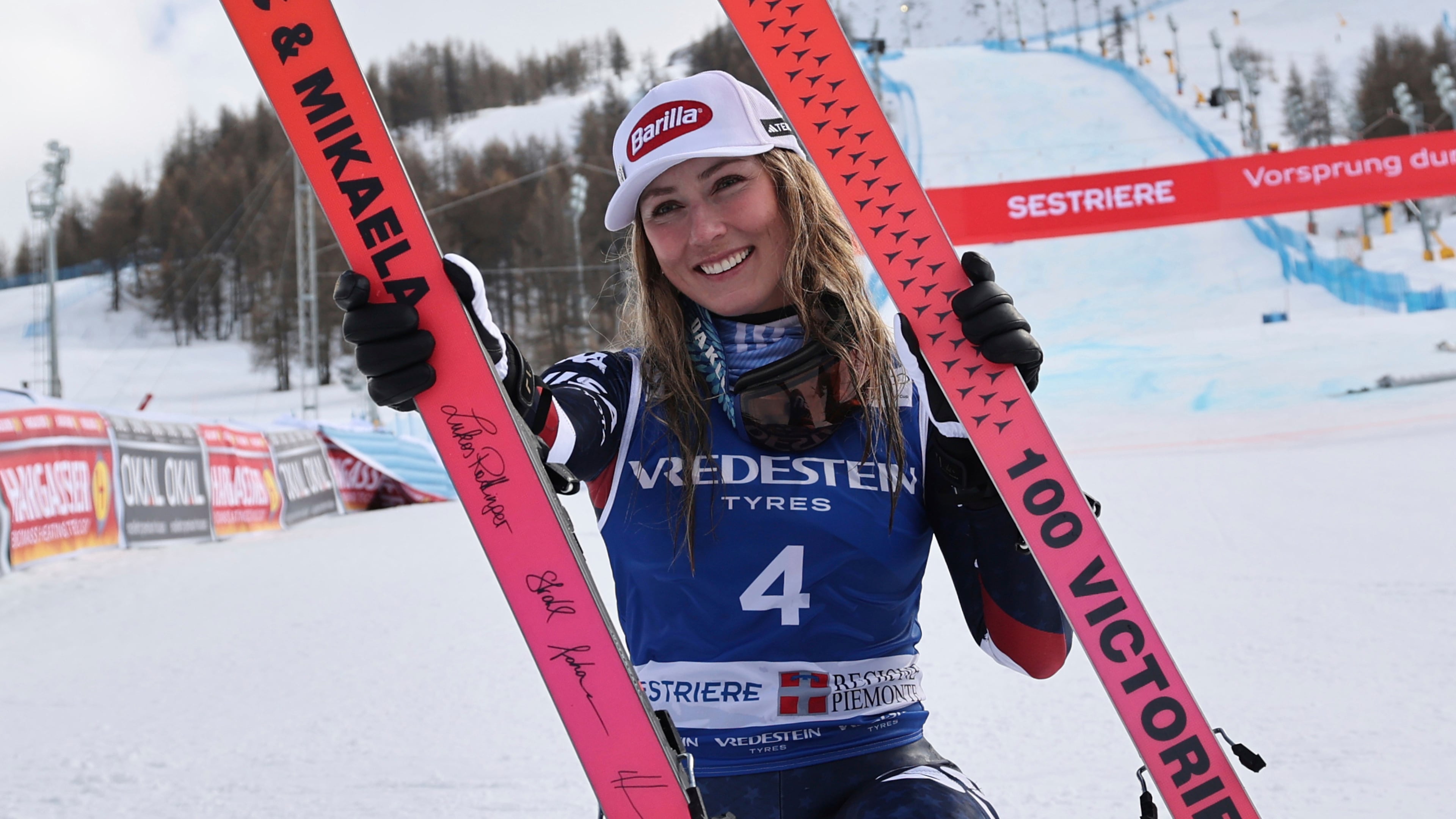 FILE - United States' Mikaela Shiffrin poses with her commemorative skis for her 100th victory after an alpine ski, women's World Cup slalom, in Sestriere, Italy, Sunday, Feb. 23, 2025. (AP Photo/Marco Trovati, File)