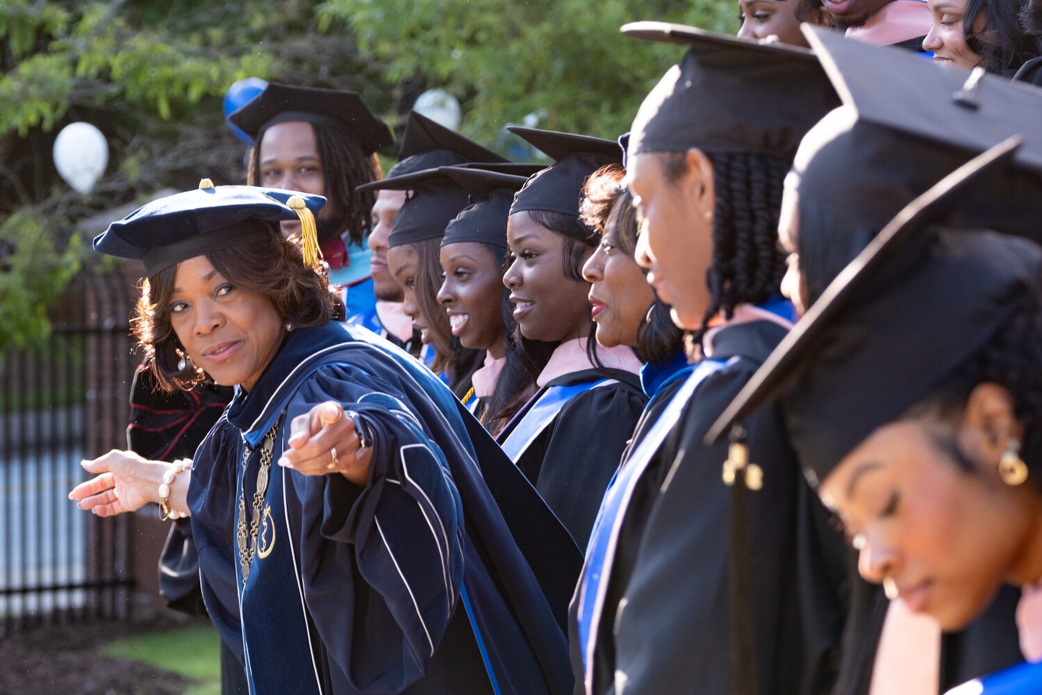 Morehouse School of Medicine President and CEO Dr. Valerie Montgomery Rice directs students to line up for a photo before the school’s graduation ceremony Saturday, May 16, 2026, in Atlanta. (Ben Gray for the AJC)