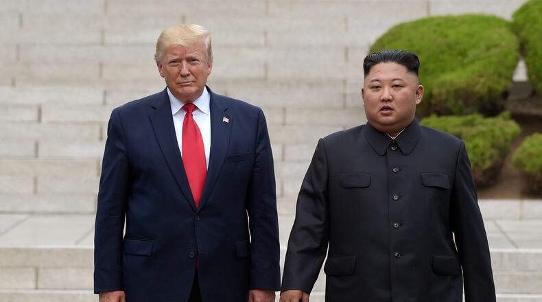 FILE - Then U.S. President Donald Trump, left, meets with North Korean leader Kim Jong Un at the North Korean side of the border at the village of Panmunjom in Demilitarized Zone, on June 30, 2019. (AP Photo/Susan Walsh, File)