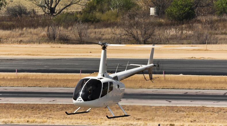 Three people, including an Atlanta landscape architect, were killed when a helicopter crashed last Wednesday in the dense woods of a national wildlife preserve in Middle Georgia, according to reports. (Patrick Allen/Dreamstime/TNS)