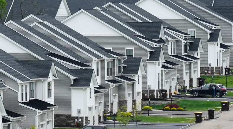 FILE - Newly developed homes sit in a row in Eagleville, Pa., April 28, 2023. (AP Photo/Matt Rourke, File)
