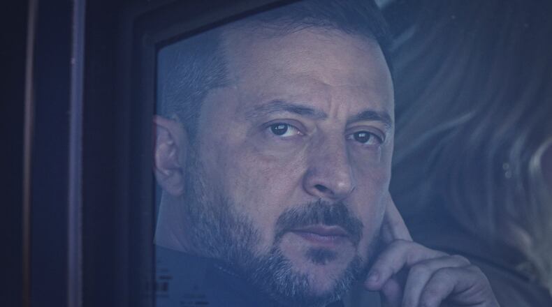 Ukraine's President Volodymyr Zelenskyy looks out from his car window as he arrives for the NATO summit in Ankara, Turkey, Tuesday, July 7, 2026. (Metin Aktaş, Pool Photo via AP)