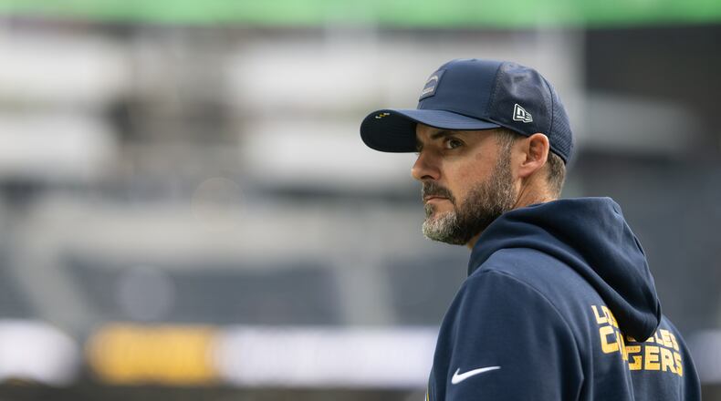 FILE - Los Angeles Chargers defensive coordinator Jesse Minter walks on the field before an NFL football game against the Las Vegas Raiders, Sunday, Nov. 30, 2025, in Inglewood, Calif. (AP Photo/Kyusung Gong, File)