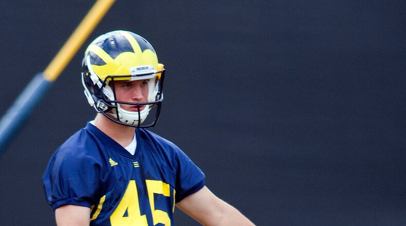 In this photo taken Tuesday, Aug. 9, 2011, Michigan kicker Matt Wile participates during NCAA college football practice, in Ann Arbor, Mich. (AP Photo/Tony Ding) s1 s1wile bw 3.27” x 5”