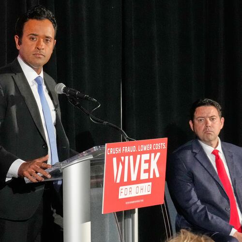 Vivek Ramaswamy, left, candidate for Governor in Ohio, and his running mate, Ohio Senate President Rob McColley, right, listen to a question during a news conference on Medicaid fraud in Columbus, Ohio, Tuesday, May 19, 2026. (AP Photo/Sue Ogrocki)