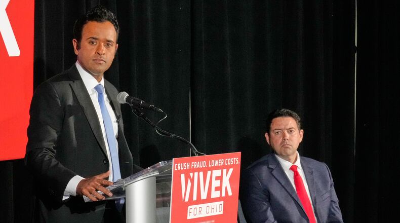 Vivek Ramaswamy, left, candidate for Governor in Ohio, and his running mate, Ohio Senate President Rob McColley, right, listen to a question during a news conference on Medicaid fraud in Columbus, Ohio, Tuesday, May 19, 2026. (AP Photo/Sue Ogrocki)