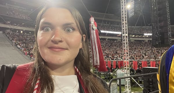 Grace Johnson takes a selfie as she walks to the stage before singing "Georgia on My Mind" at Sanford Stadium. Provided