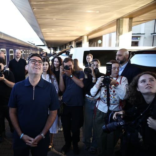 Britain's prime minister Andy Burnham, centre, smiles upon his arrival by train, in Kyiv, Monday, Aug. 24, 2026. (Henry Nicholls/Pool Photo via AP)