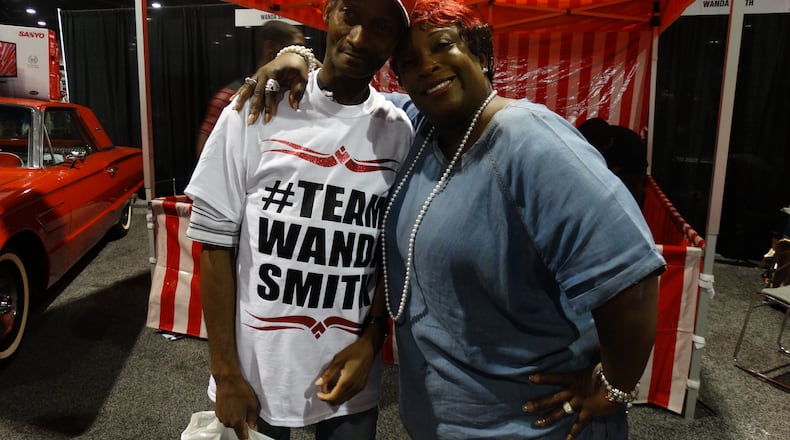 Wanda Smith pow wows with fans at the V-103 Car and Bike Show July 25, 2015. Here she is with Fred Smith (no relation), who has been a fan of her since she arrived at V-103 about 18 years ago. CREDIT: Rodney Ho/rho@ajc.com