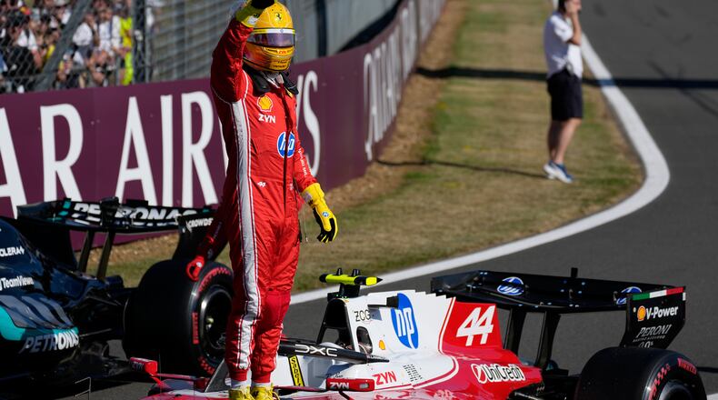 Ferrari driver Lewis Hamilton of Britain celebrates after setting a pole position for the sprint race at the British F1 Grand Prix, in Silverstone, England, Friday, July 3, 2026. (AP Photo/Darko Bandic)