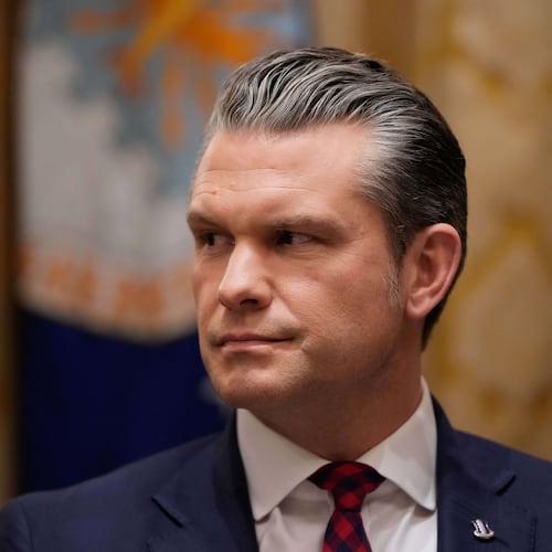 Defense Secretary Pete Hegseth listens as President Donald Trump speaks during a Cabinet meeting at the White House, Tuesday, Dec. 2, 2025, in Washington. (AP Photo/Julia Demaree Nikhinson)