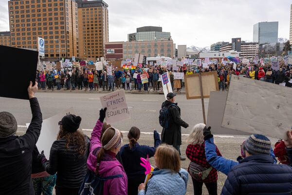 Demonstrators march during a rally against President Donald Trump, in Anchorage, Alaska, on Saturday, April 5, 2025, as part of the nationwide "Hands Off!" protest. (Loren Holmes/Anchorage Daily News via AP)