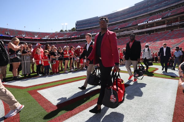 Georgia Bulldogs linebacker E.J. Lightsey and teammates walks onto the field during the Dawg Walk before their game against the Vanderbilt Commodores at Sanford Stadium, Saturday, Oct. 15, 2022, in Athens. (Jason Getz/AJC)