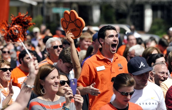 Mercer University fans enjoy seeing the clock run out at their viewing party Friday, March 21, 2014, in Macon, Ga., as the Bears upset Duke, 78-71 in an NCAA college basketball tournament game. (Woody Marshall/AP)