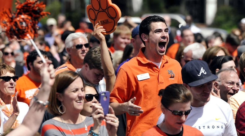 Mercer University fans enjoy seeing the clock run out at their viewing party Friday, March 21, 2014, in Macon, Ga., as the Bears upset Duke, 78-71 in an NCAA college basketball tournament game. (AP Photo/The Telegraph, Woody Marshall)