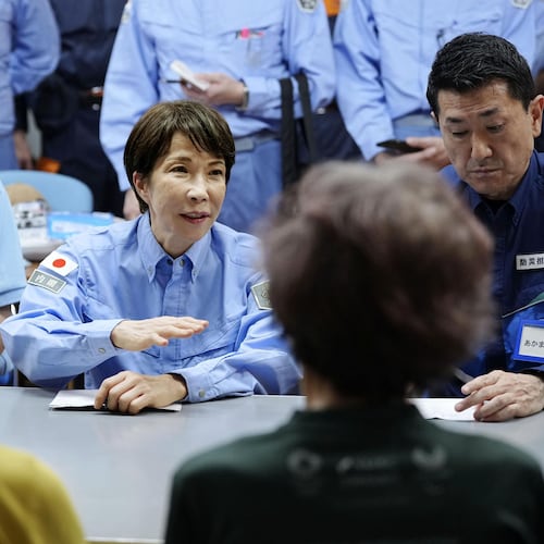 Japan's Prime Minister Sanae Takaichi meets evacuees as she visits an evacuation center in Hikawa, southern Japan, Monday, Aug. 3, 2026. (Japan Pool/Kyodo News via AP)