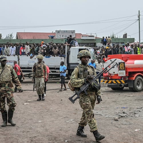 FILE - M23 rebels escort government soldiers and police who surrendered to an undisclosed location in Goma, Democratic republic of the Congo, Jan. 30, 2025. (AP Photo/Moses Sawasawa, File)