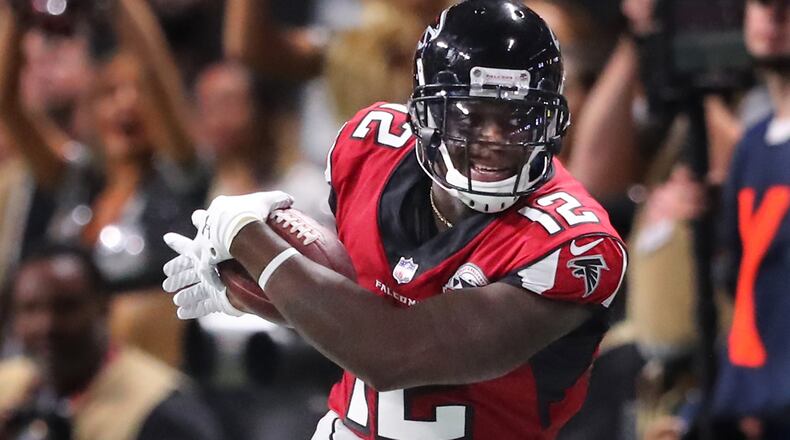 Falcons wide receiver Mohamed Sanu makes a first down catch against the Green Bay Packers Sunday, Sept. 17, 2017, in Atlanta.