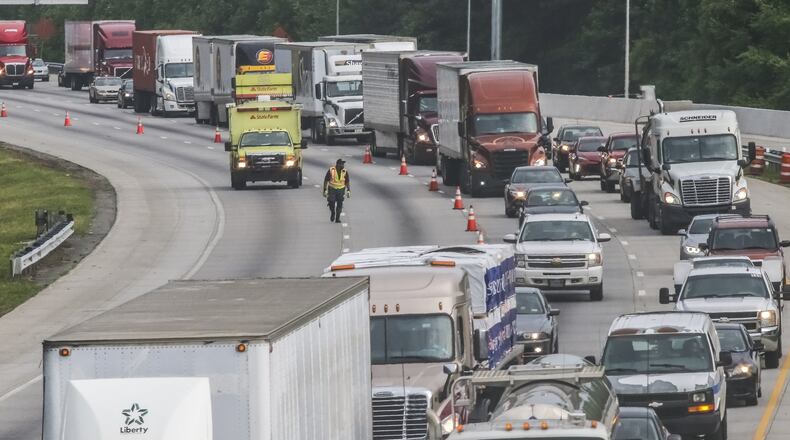File Photo: Earlier this year, a tractor-trailer hauling 19 cows overturned on I-75 South in Cobb County, causing the road to be temporarily shut. JOHN SPINK/JSPINK@AJC.COM