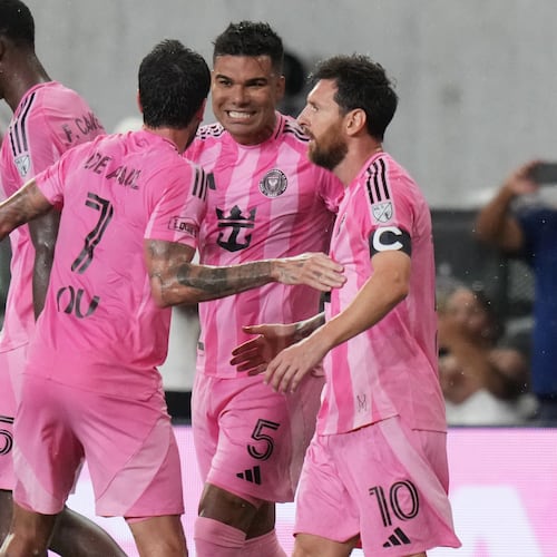 Inter Miami midfielder Casemiro (5) celebrates with midfielder Rodrigo De Paul (7) and forward Leo Messi (10) after scoring a goal during the first half of an MLS soccer match against Atlanta United, Saturday, Sept. 5, 2026, in Miami. (AP Photo/Lynne Sladky)