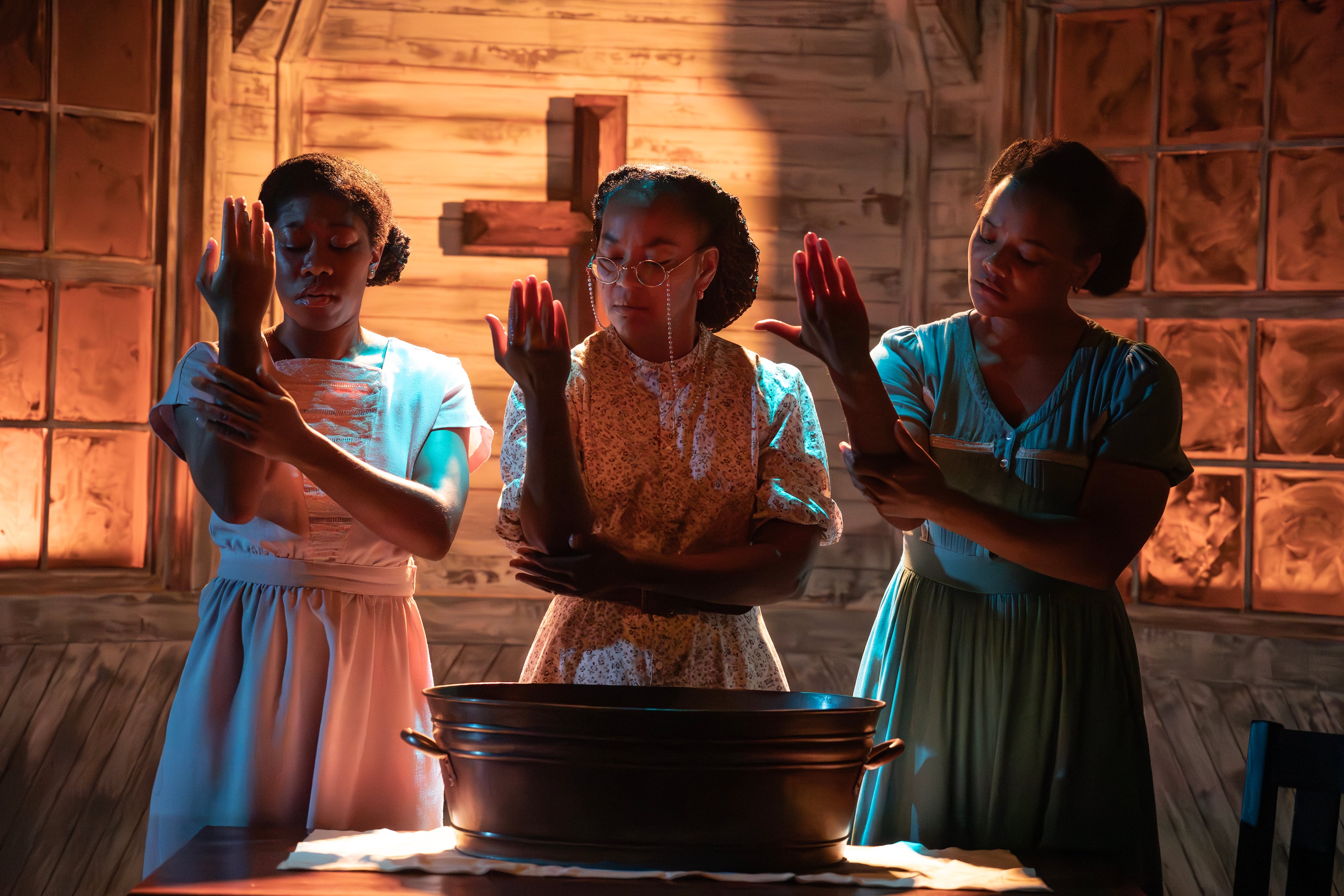 Shadows and eerie lighting that cast silhouettes on stage is a design aspect Alliance Theatre's artistic director Tinashe Kajese-Bolden felt was important to recreate when staging "Covenant" at Hertz Stage. Pictured here: Violet, Mama and Avery in Roundabout Theatre's staging of the play in New York.