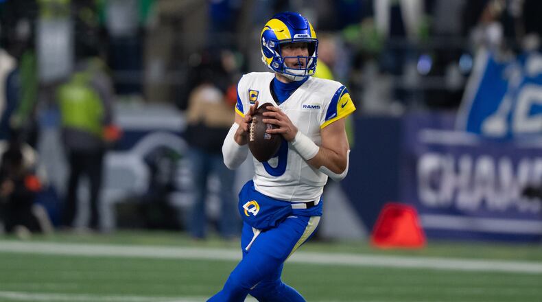 FILE - Los Angeles Rams quarterback Matthew Stafford drops back to pass during a NFC Championship football game against the Seattle Seahawks, Jan. 25, 2026, in Seattle. (AP Photo/Stephen Brashear, File)