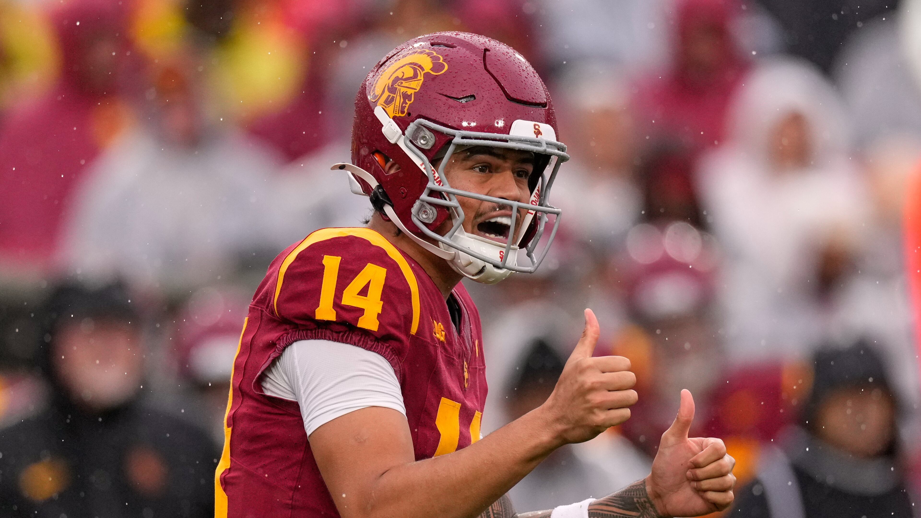 Southern California quarterback Jayden Maiava gestures to teammates during the first half of an NCAA college football game against Iowa, Saturday, Nov. 15, 2025, in Los Angeles. (AP Photo/Mark J. Terrill)