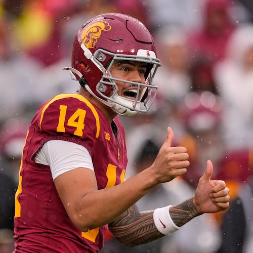 Southern California quarterback Jayden Maiava gestures to teammates during the first half of an NCAA college football game against Iowa, Saturday, Nov. 15, 2025, in Los Angeles. (AP Photo/Mark J. Terrill)