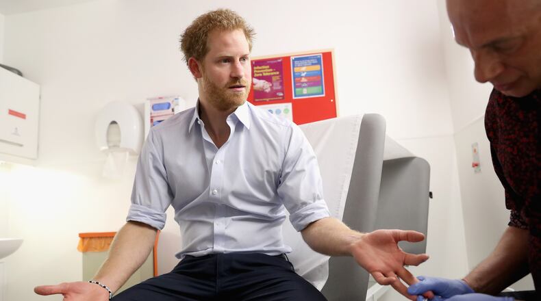 LONDON, ENGLAND - JULY 14: Prince Harry has blood taken by Specialist Psychotherapist Robert Palmer as he takes an HIV test during a visit to Burrell Street Sexual Health Clinic on July 14, 2016 in London, England. Prince Harry was visiting the clinic, run by Guy's and St Thomas NHS Foundation to promote the importance of getting tested for HIV and other STDs. (Photo by Chris Jackson/Getty Images)