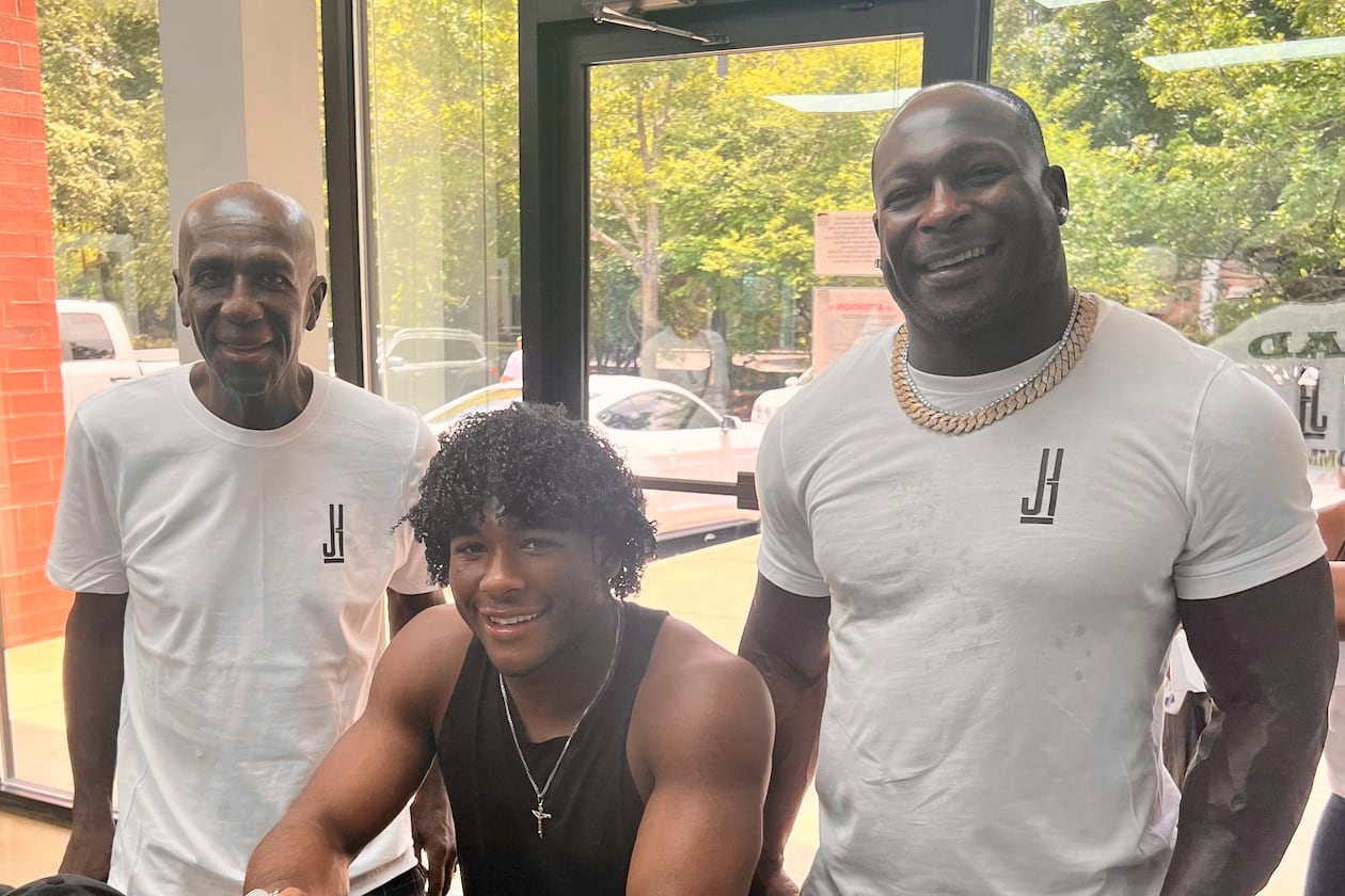 Justice Haynes and his father Verron Haynes (right) and grandfather Ulric "Buggy" Haynes (left) on July 17, 2022 after Justice Haynes verbally committed to play college football for Alabama. (Courtesy)