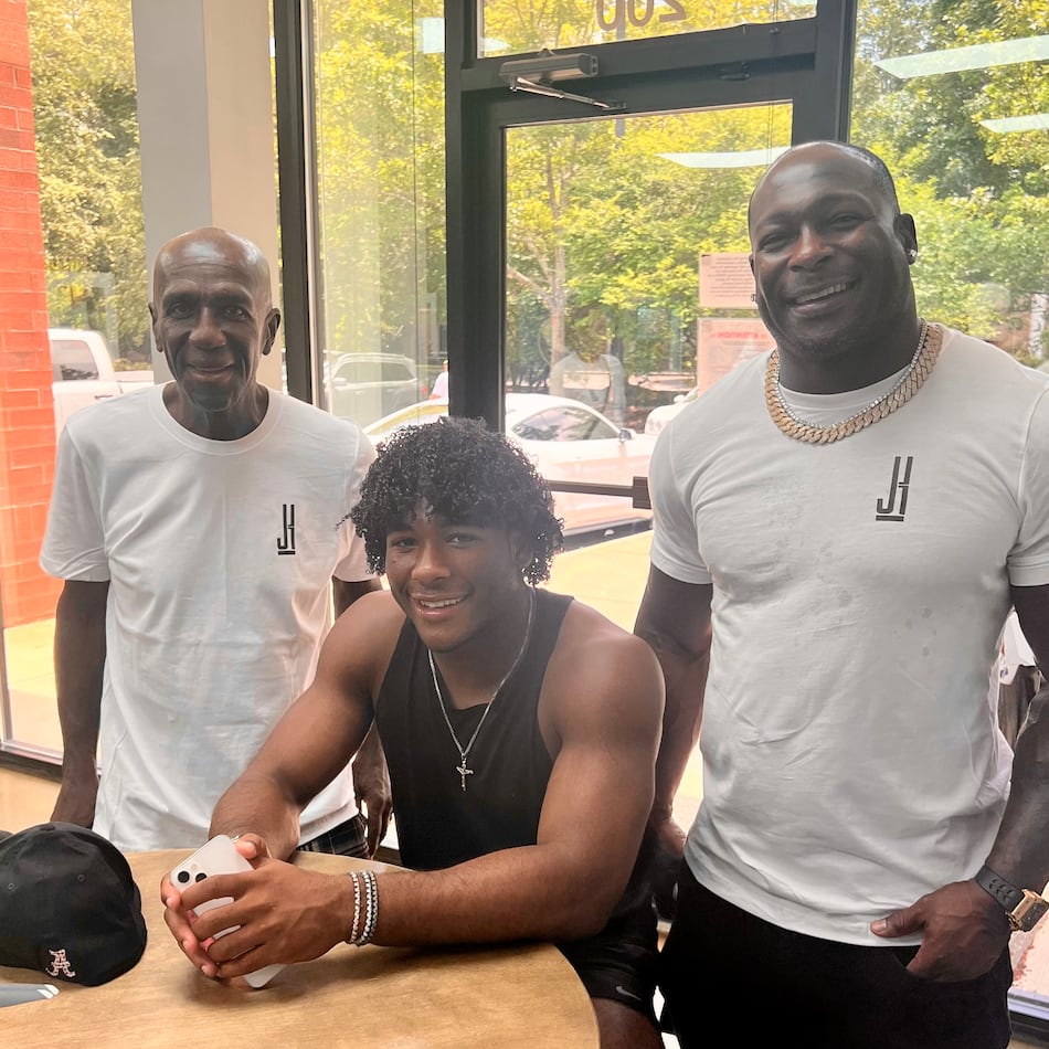 Justice Haynes and his father Verron Haynes (right) and grandfather Ulric "Buggy" Haynes (left) on July 17, 2022 after Justice Haynes verbally committed to play college football for Alabama. (Courtesy)