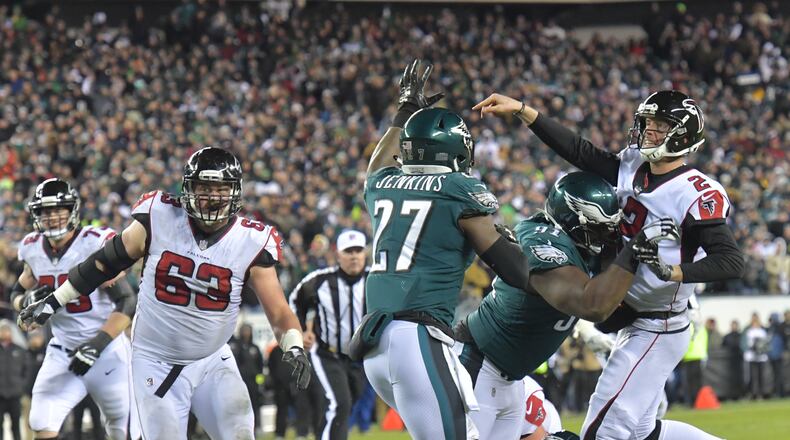 Atlanta Falcons quarterback Matt Ryan (2) gets off a pass under pressure from Philadelphia Eagles defensive tackle Fletcher Cox (91) in the NFC Divisional Game at Lincoln Financial Field in Philadelphia, PA on Saturday, Jan. 13, 2018.