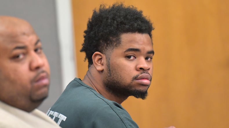 December 11, 2018 Lawrenceville - Deandre Tucker sits with his lawyer Jacoby Hudson (left) during a hearing of Deandre Tucker's codefendant Carinthius Henry at Gwinnett County courthouse on Tuesday, December 11, 2018. Tucker violated his parole but continued to slip through the cracks. HYOSUB SHIN / HSHIN@AJC.COM
