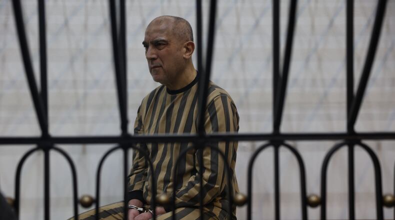 Atef Najib, former head of the Political Security Branch in the Daraa area during Bashar Assad's rule, sits in the defendants' cage during a trial session at the Palace of Justice in Damascus, Syria, Sunday, April 26, 2026. (AP Photo/Ghaith Alsayed)