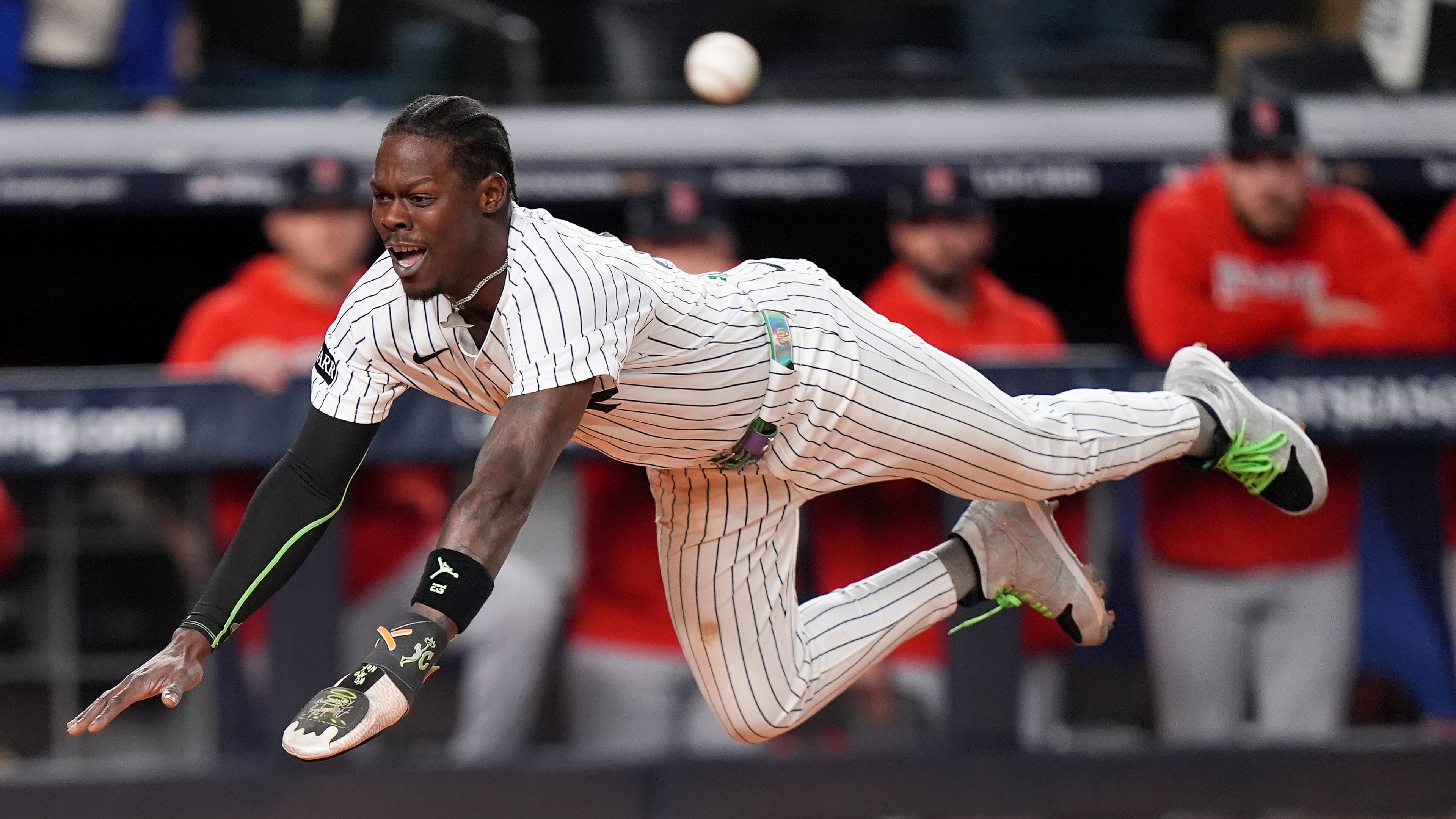 New York Yankees Jazz Chisholm Jr. dives into home plate to score on a hit by Austin Wells against the Boston Red Sox during the eighth inning of Game 2 of an American League wild-card baseball playoff series, Wednesday, Oct. 1, 2025, in New York. (AP Photo/Frank Franklin II)