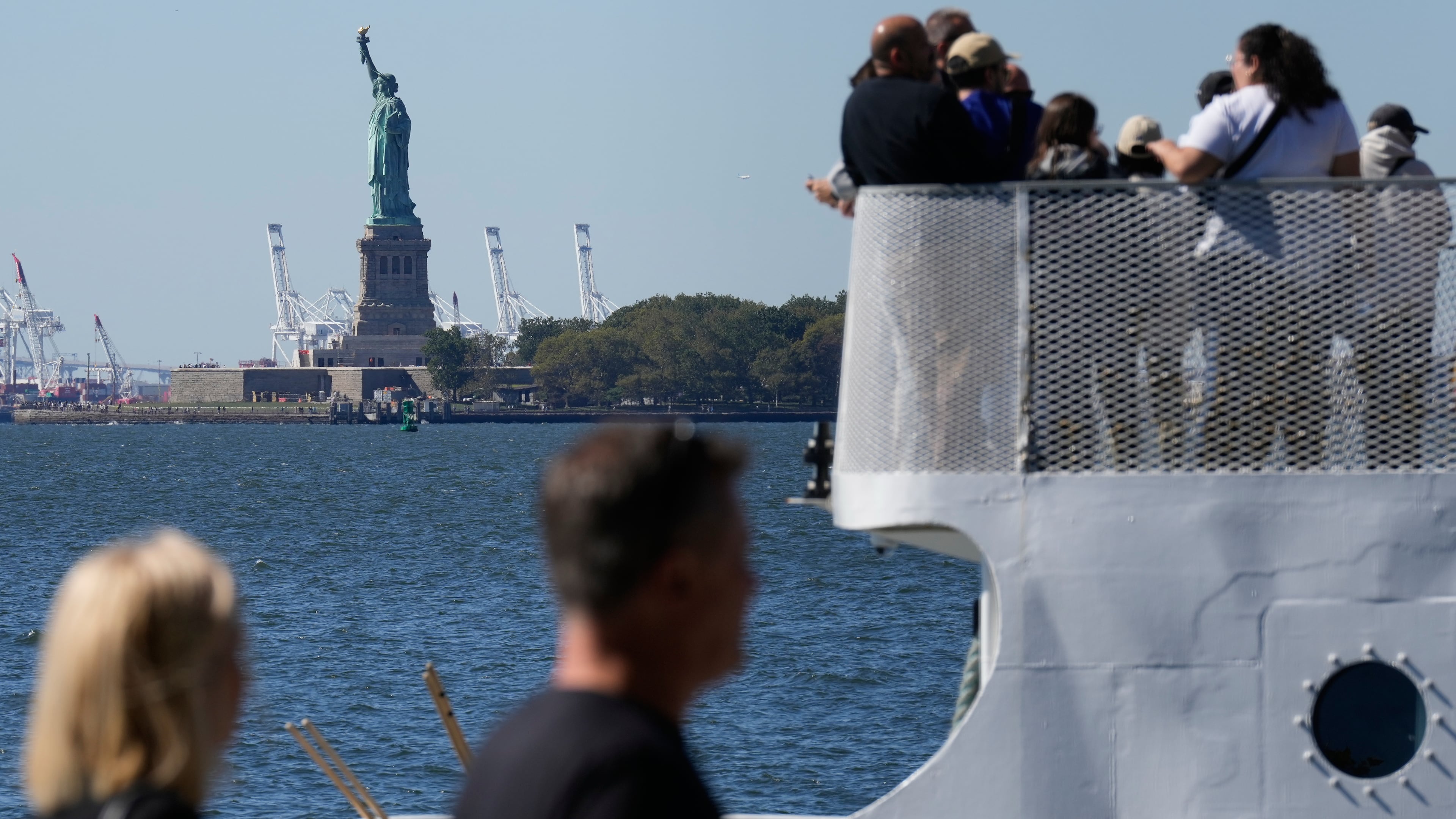 People board a boat headed to the Statue of Liberty in New York, Wednesday, Oct. 1, 2025. (AP Photo/Seth Wenig)