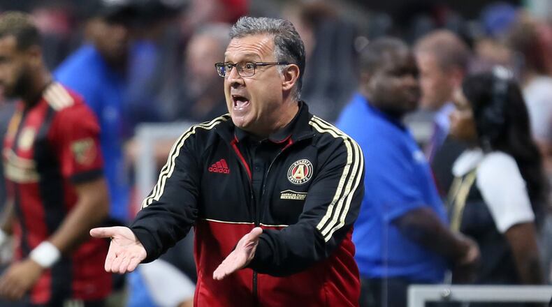 Atlanta United coach Gerardo 'Tata' Martino gives direction to his players during the second half.
