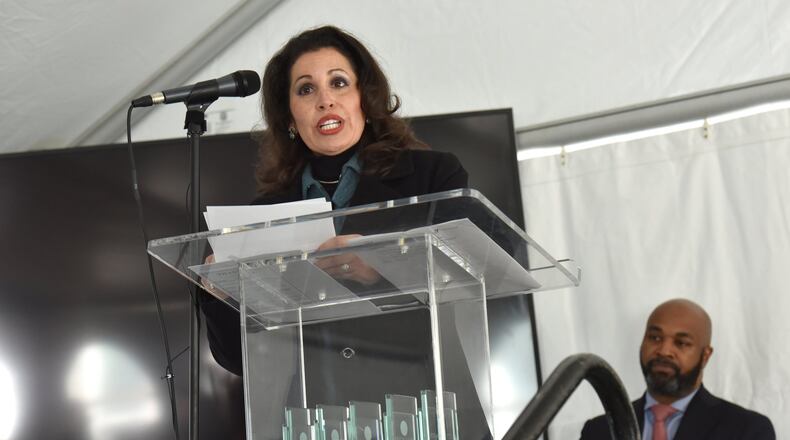 December 15, 2016 Atlanta - Eloisa Klementich, CEO of Invest Atlanta, speaks as councilman Kwanza Hall (background) looks during City of Lights Grand Opening Celebration at City Lights Senior Housing, a new affordable senior housing facility, in Atlanta on Thursday, December 15, 2016. Kwanza Hall takes the wraps off a new affordable housing development for seniors on Thursday in his downtown district. HYOSUB SHIN / HSHIN@AJC.COM