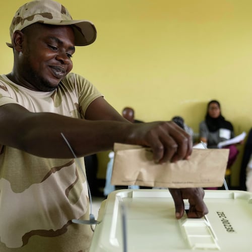 A security personnel member casts his vote during early voting in the general elections at Tumekuja Secondary School polling station in Zanzibar, Tanzania, Tuesday, Oct. 28, 2025. (AP Photo/Brian Inganga)