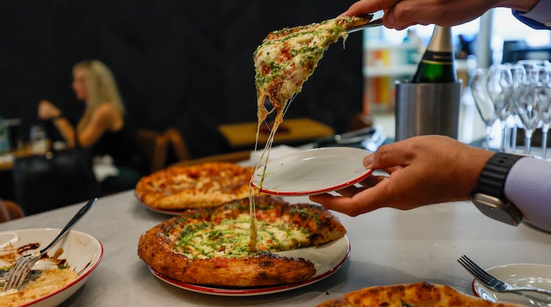 Gourmet pizza is among the offerings at Southern National Market and Pizza Boxx at Hartsfield-Jackson Atlanta International Airport.
(Miguel Martinez / AJC)
