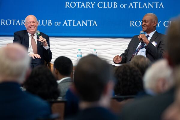 Raphael Bostic (right), outgoing president of the Federal Reserve Bank of Atlanta, interviews Jeffrey Sprecher, CEO and founder of Intercontinental Exchange, during a meeting of the Rotary Club of Atlanta on Monday, Jan. 12, 2026. (Ben Gray for the AJC)