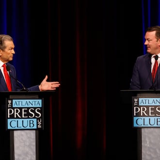Republican candidates for governor Rick Jackson (left) and Lt. Gov. Burt Jones interact at the Atlanta Press Club Loudermilk-Young Republican governor primary election debate Monday, April 27, 2026, at Georgia Public Broadcasting in Atlanta. (Arvin Temkar/AJC)