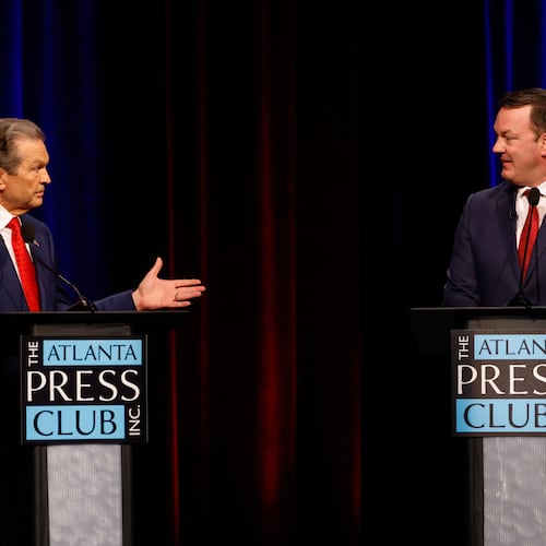 Republican candidates for governor, Rick Jackson, left, and Lt. Gov. Burt Jones interact at the Atlanta Press Club Loudermilk-Young primary election debate at Georgia Public Broadcasting on Monday. (Arvin Temkar/AJC)