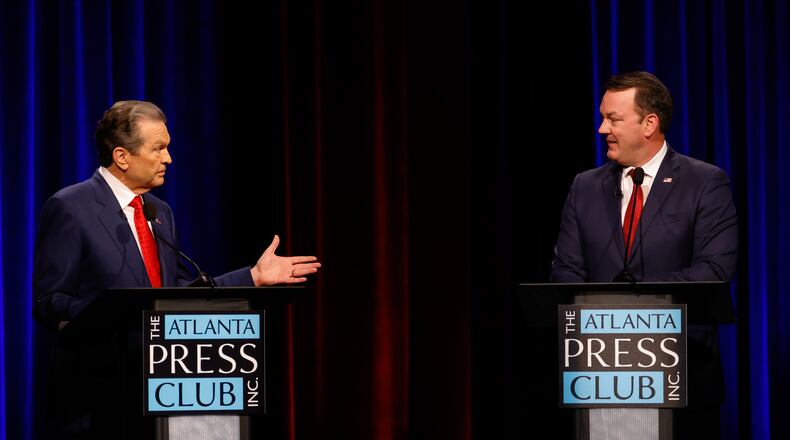 Republican candidates for governor, Rick Jackson, left, and Lt. Gov. Burt Jones interact at the Atlanta Press Club Loudermilk-Young primary election debate at Georgia Public Broadcasting on Monday. (Arvin Temkar/AJC)