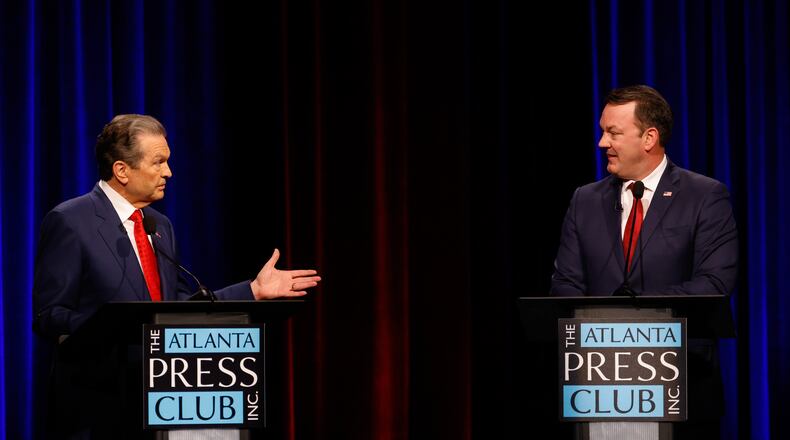 Republican candidates for governor, Rick Jackson, left, and Lt. Gov. Burt Jones interact at the Atlanta Press Club Loudermilk-Young primary election debate at Georgia Public Broadcasting on Monday. (Arvin Temkar/AJC)
