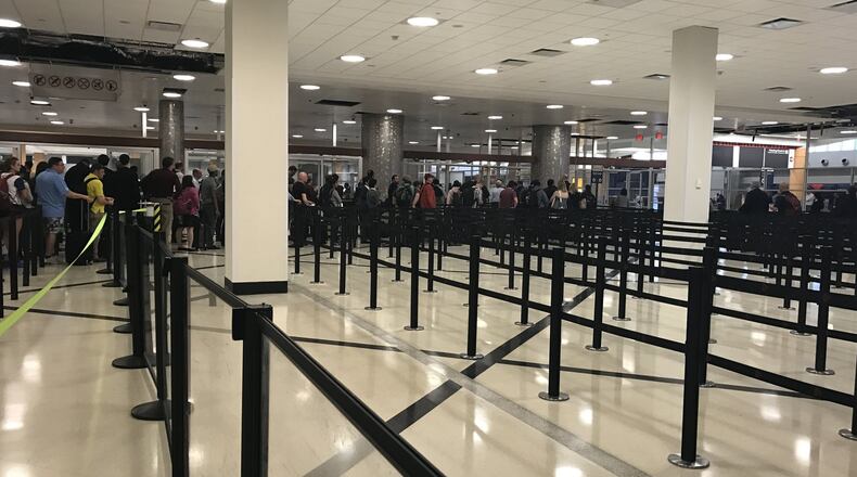 The expanded security line area at Hartsfield-Jackson’s domestic terminal main checkpoint has more room to handle passengers. KELLY YAMANOUCHI/kyamanouchi@ajc.com
