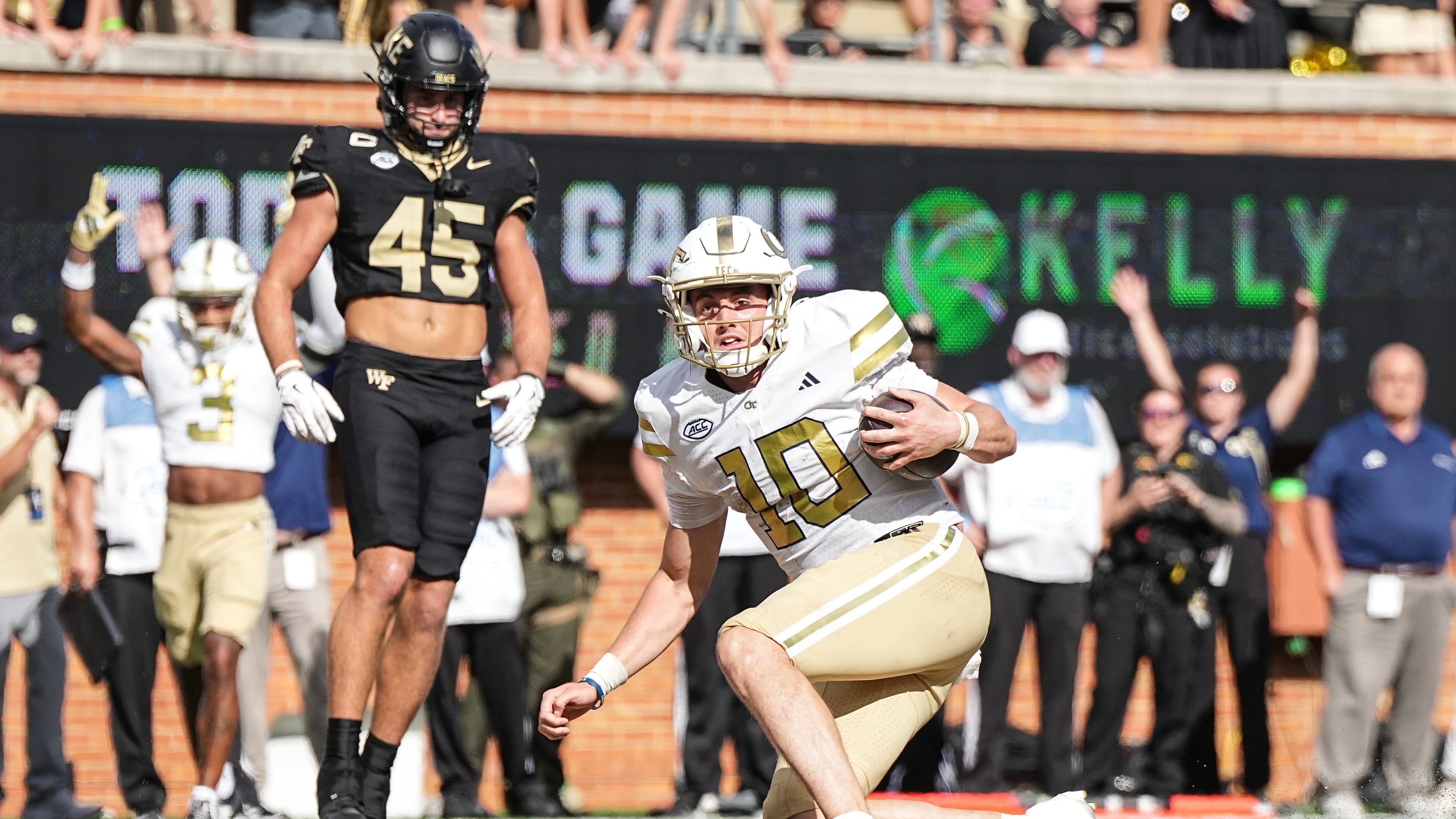 Georgia Tech quarterback Haynes King (10) scores a touchdown during overtime in an NCAA college football game against Wake Forest, Saturday, Sept. 27, 2025, in Winston-Salem, N.C. (AP Photo/Matt Kelley)
